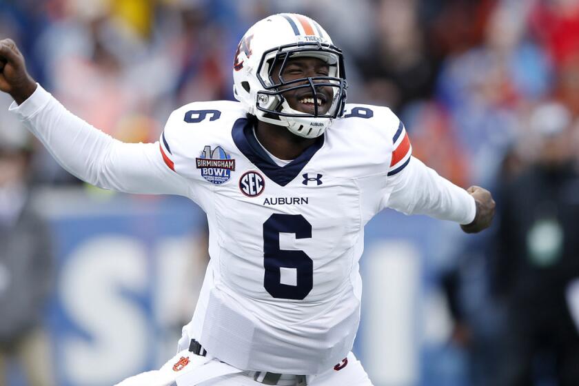 Auburn's Jeremy Johnson celebrates after passing for an 11-yard touchdown against Memphis in the third quarter of the Birmingham Bowl on Wednesday.