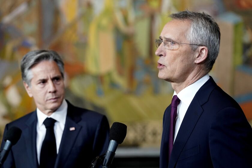 U.S. Secretary of State Antony Blinken, left, listens as NATO Secretary-General Jens Stoltenberg gives a statement to the media, at Oslo City Hall, during a meeting of NATO's foreign ministers in Oslo, Thursday, June 1, 2023. (Lise Aserud/NTB Scanpix via AP)