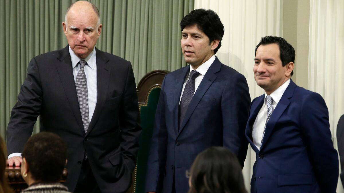 California Gov. Jerry Brown (left), Senate President Pro Tem Kevin de León, D-Los Angeles (center), and Assembly Speaker Anthony Rendon, D-Paramount (right), are seen after Rendón was sworn-in as speaker of the Assembly in Sacramento, Calif. on March 7.