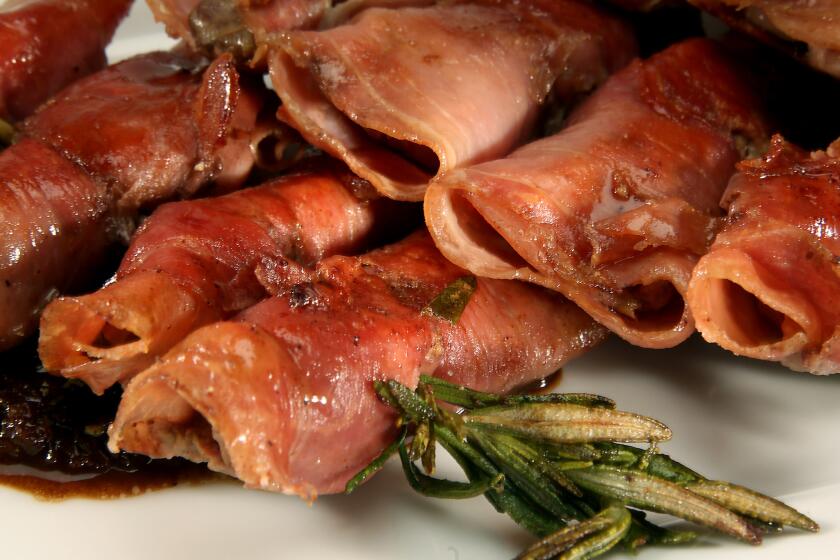 Prosciutto-wrapped chicken livers on rosemary skewers