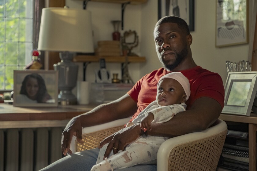 This image released by Netflix shows Kevin Hart in a scene from "Fatherhood." (Philippe Bosse/Netflix via AP)