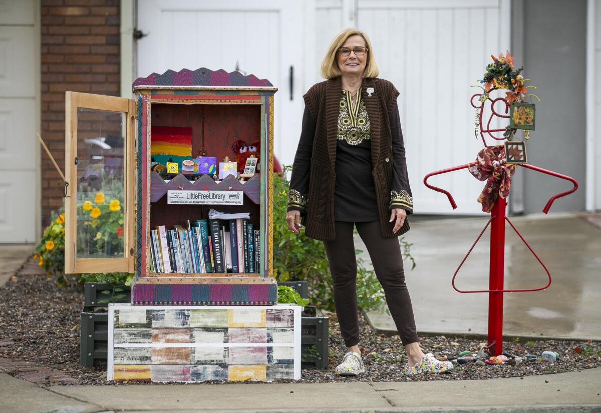 Charlene Ashendorf with a Little Free Library at her Montana Avenue home.