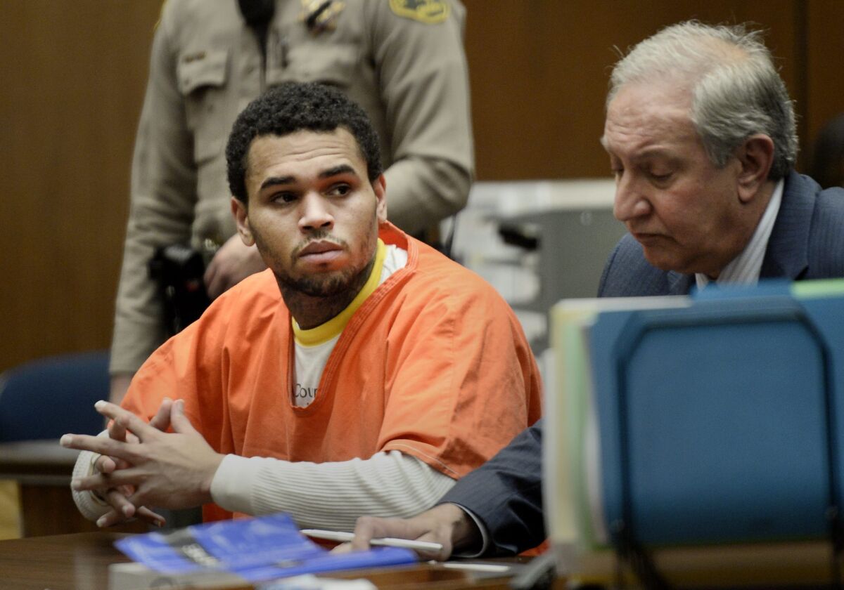 Chris Brown, left, appears in court with his attorney, Mark Geragos on May 9. The singer was released early from county jail on Monday.