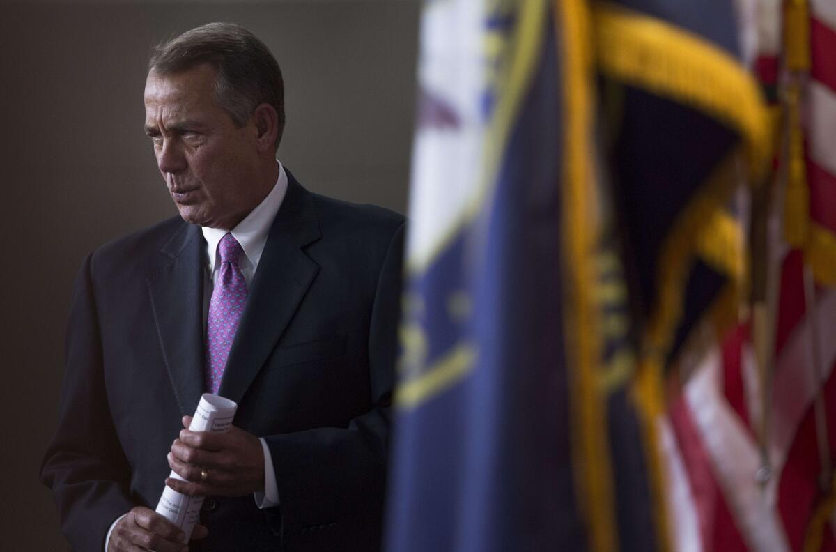 House Speaker John A. Boehner (R-Ohio) arrives for a news conference on Capitol Hill.