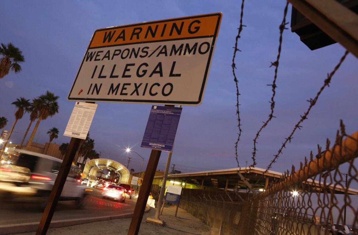 A sign on Highway 111 at the Calexico crossing into Mexico warns against weapons and ammo. Some say the border city's Police Department has long been run like a fiefdom.