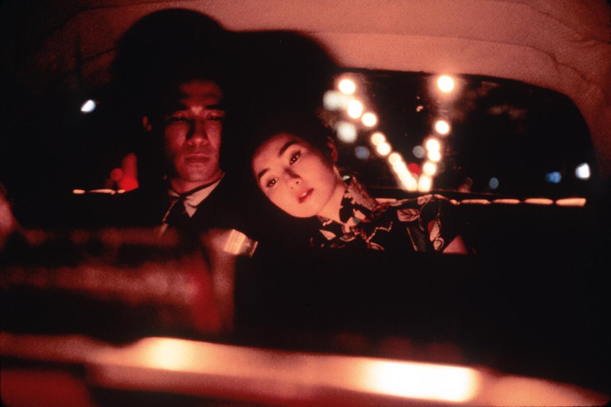 Tony Leung, left, and Maggie Cheung star in Wong Kar-wai's "In The Mood For Love" MOVIE SCHEDULE RELEASE FEB 2, 2001