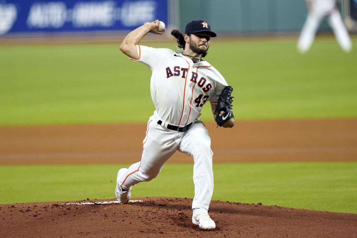 Houston Astros' Lance McCullers Jr. throws against the San Francisco Giants during the first inning of a baseball game Monday, Aug. 10, 2020, in Houston. (AP Photo/David J. Phillip)