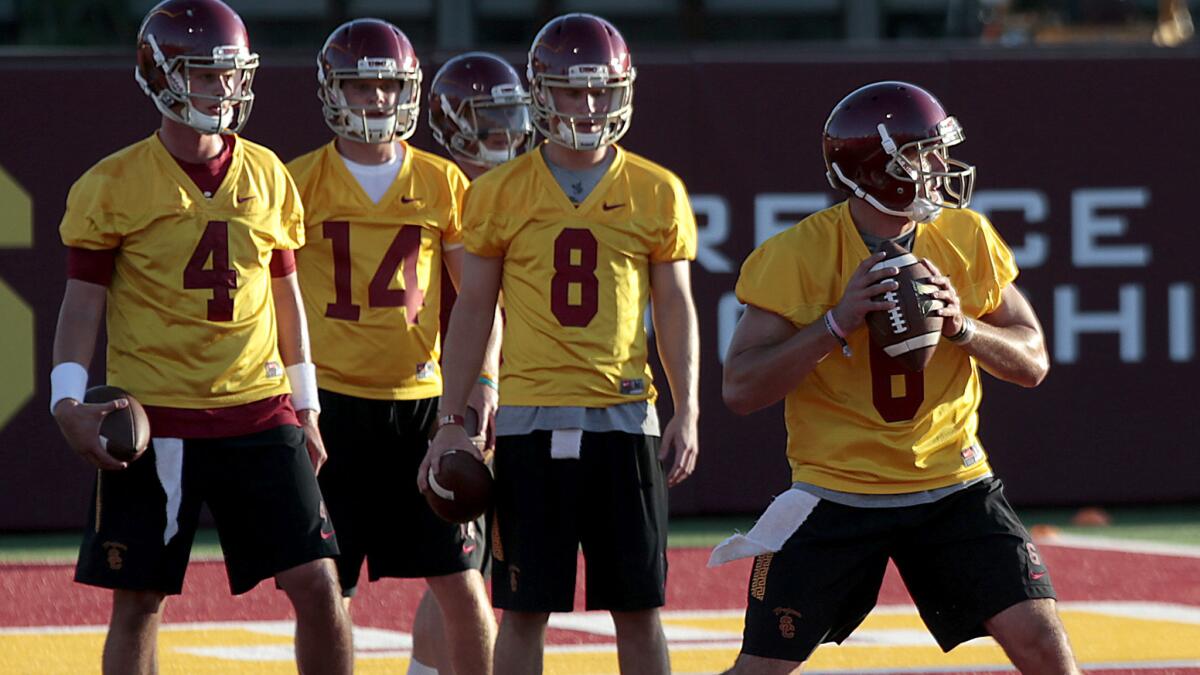 Ricky Town (8) waits in line during a passing drill at USC as Cody Kessler (6) takes his turn on Aug. 8, 2015.