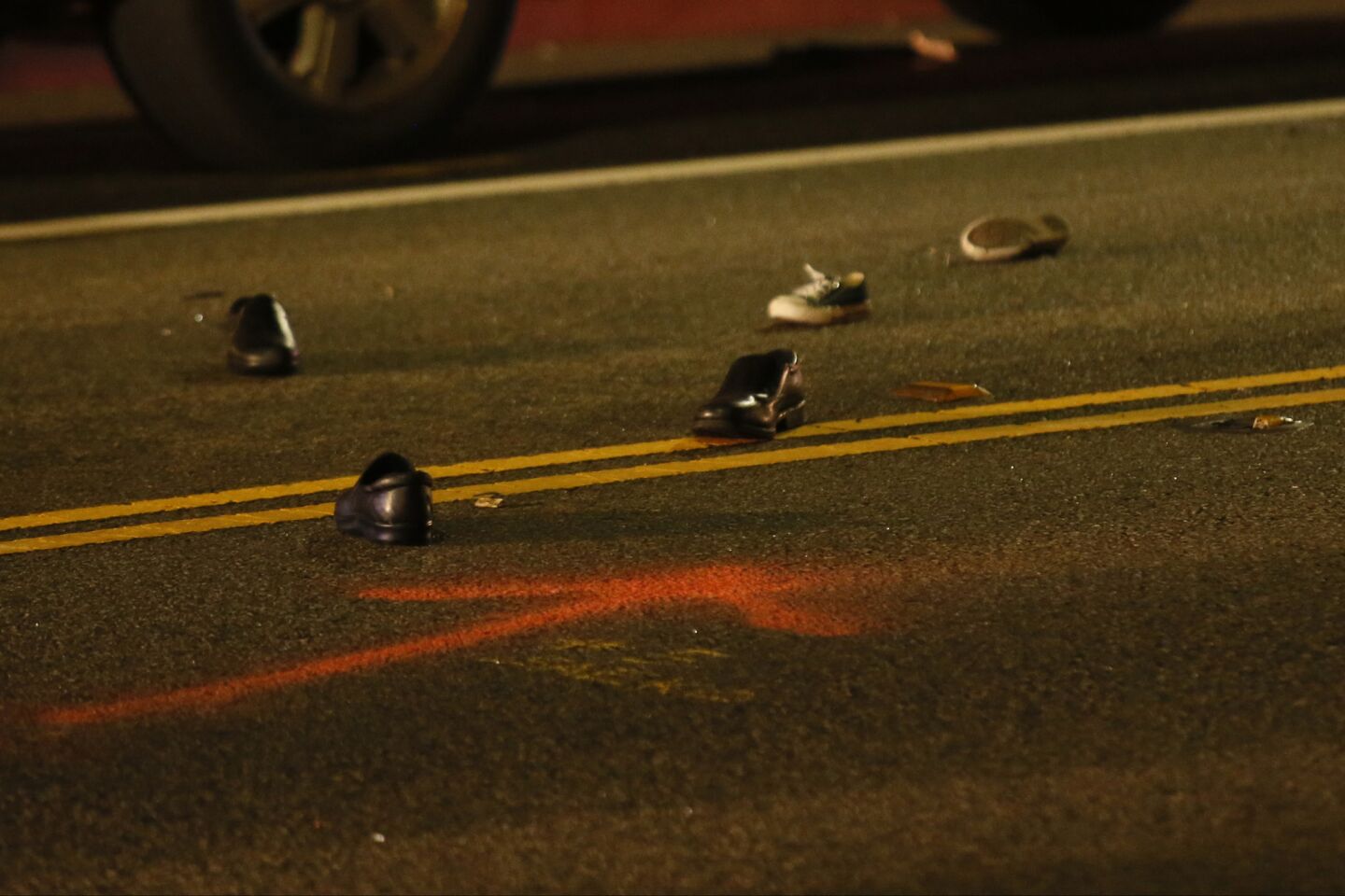 Shoes lie scattered on the road after the fatal accident near St. James Church in Redondo Beach.