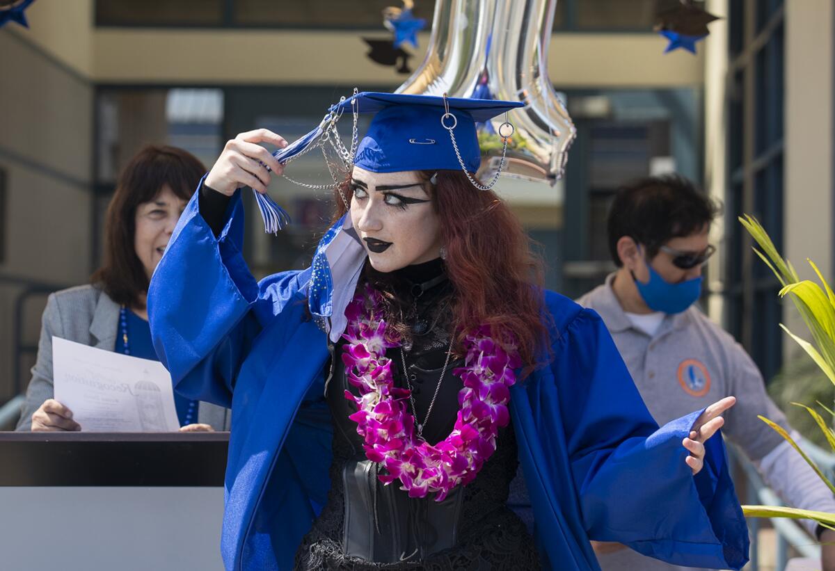 Reina Davis moves her tassel to the left side of her cap during the Valley Vista High School graduation on Wednesday.