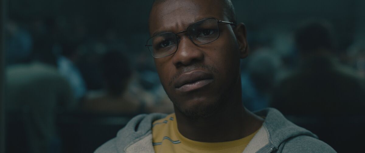 A closeup of a man wearing glasses who looks confused.