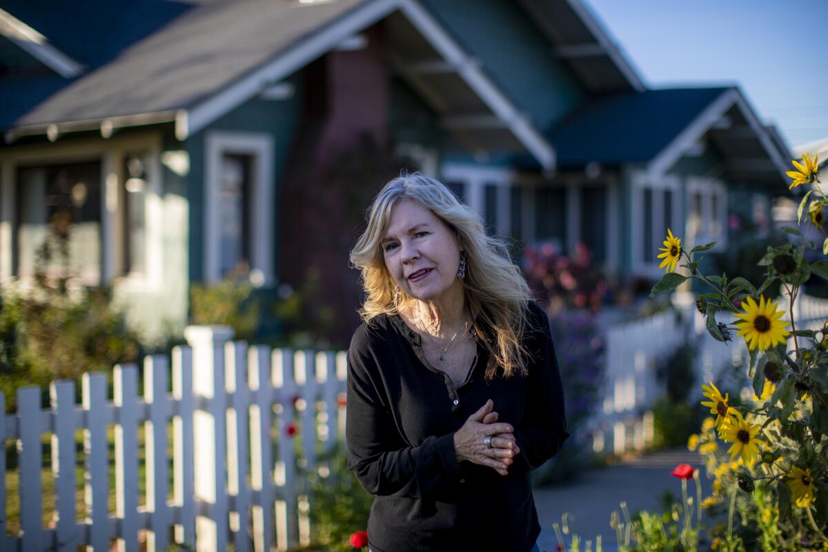 Author Susan Straight in front of her home.