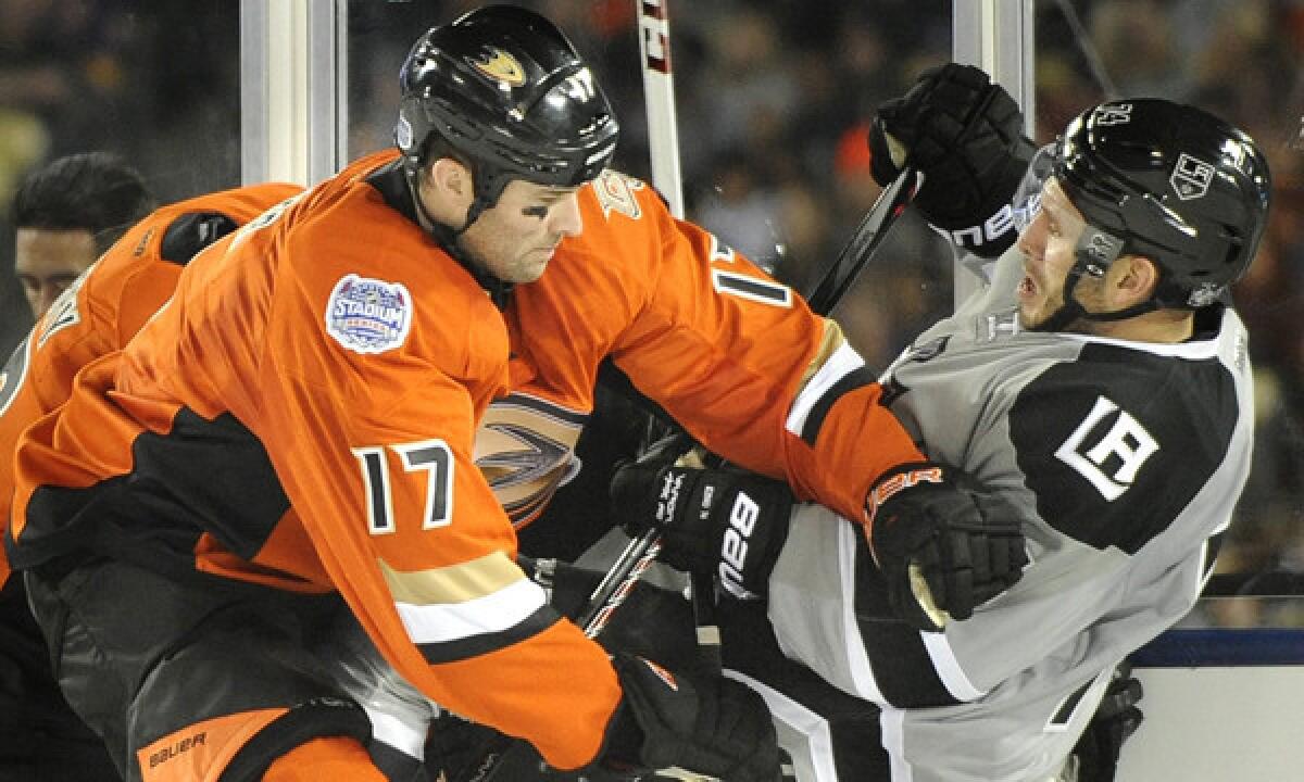 Ducks forward Dustin Penner, left, tangles with Kings forward Dwight King during the Ducks' win at Dodger Stadium on Jan. 25. Penner, who has won Stanley Cups with both the Ducks and Kings, was traded to the Washington Capitals on Tuesday.