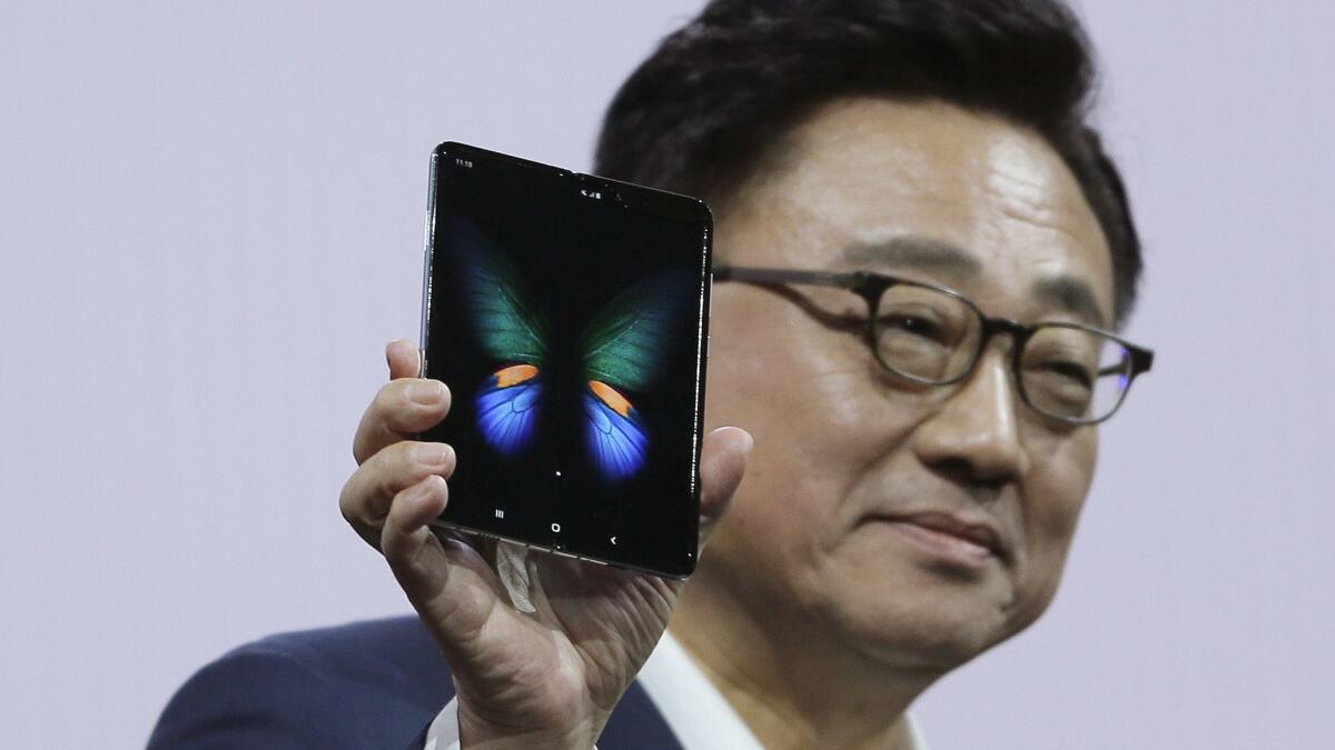 Samsung takes on Apple with $1,980 smartphone that unfolds into a tablet -  Los Angeles Times