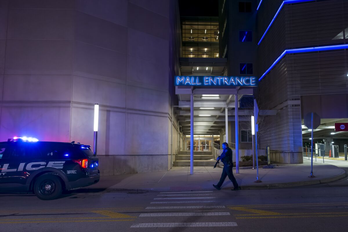 Authorities work the scene outside the Rosemont Outlet Mall where a fatal shooting occurred inside, Friday, March 25, 2022, in Rosemont, Ill. (Tyler Pasciak LaRiviere/Chicago Sun-Times via AP)
