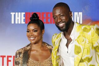 Dwyane Wade and his wife Gabrielle Union pose together at a special screening of the Netflix documentary film "The Redeem Team," Thursday, Sept. 22, 2022, at the Netflix Tudum Theater in Los Angeles. (AP Photo/Chris Pizzello)