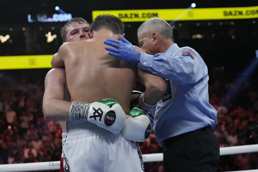 Canelo Alvarez, left, embraces Gennady Golovkin after defeating Golovkin in their super middleweight title boxing match, Saturday, Sept. 17, 2022, in Las Vegas. (AP Photo/John Locher)