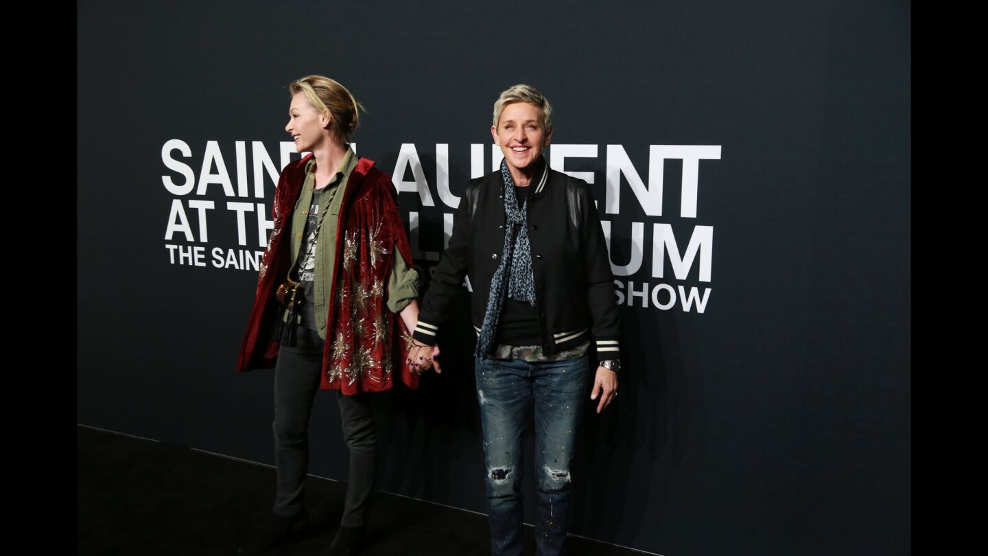 Ellen DeGeneres and Portia de Rossi at the Saint Laurent fashion show.