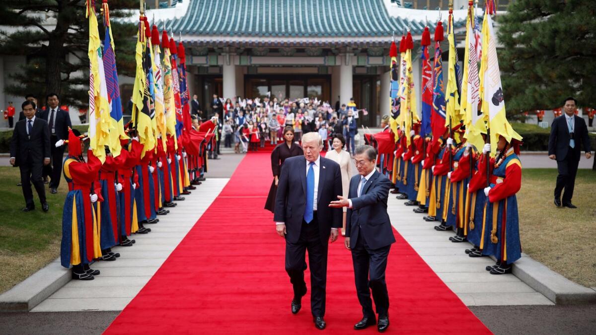 President Trump and South Korean President Moon Jae-in during a welcoming ceremony in Seoul.