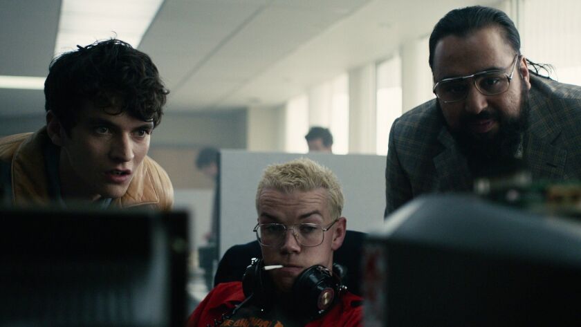 Fionn Whitehead, from left, Will Poulter and Asim Chaudhry in a scene from the "Bandersnatch" episode of Netflix's "Black Mirror."