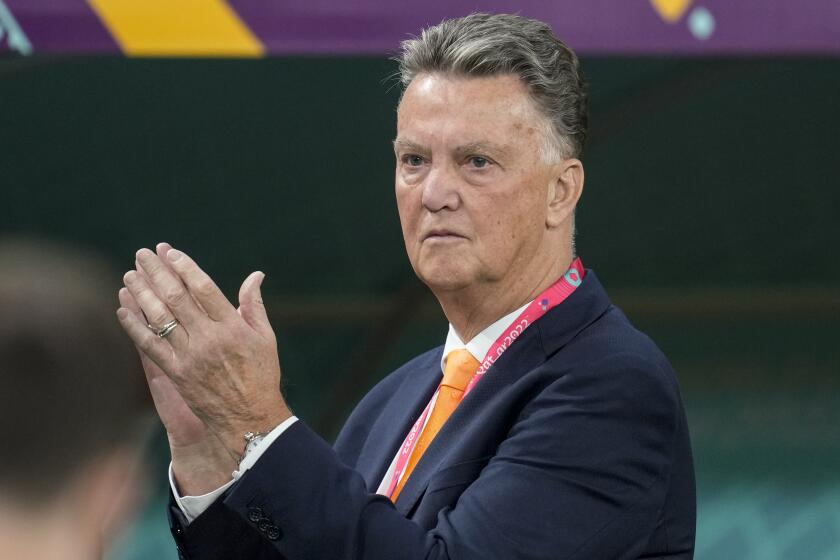 FILE - Then head coach Louis van Gaal of the Netherlands applauds prior to the start of the World Cup group A soccer match between Netherlands and Ecuador in Doha, Qatar, Friday, Nov. 25, 2022. Veteran coach Louis van Gaal is coming out of retirement to help get Dutch power Ajax get back on track after one if its worst season starts in decades. The Amsterdam club, a four-time European champion, announced late Tuesday that 72-year-old Van Gaal will advise the Ajax Supervisory Board “on football technical matters.” (AP Photo/Natacha Pisarenko, File)