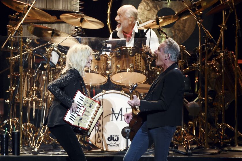 Honorees Christine McVie, left, Mick Fleetwood and Lindsey Buckingham of Fleetwood Mac perform onstage at the 2018 MusiCares Person of the Year tribute honoring Fleetwood Mac at Radio City Music Hall in New York.