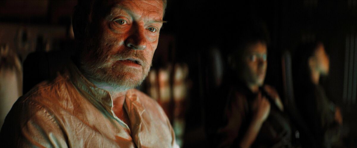 Jared Harris as Hari Seldon in a dirty white shirt, looking toward the right.