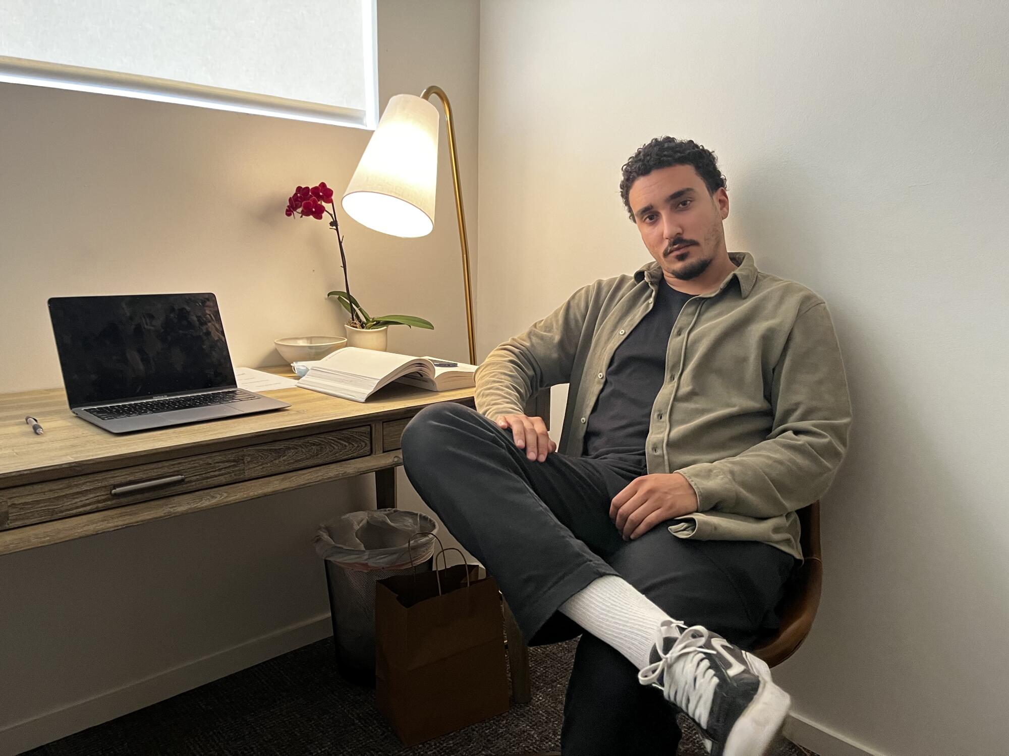 Gabe Marks at his desk in the Mission Harbor Behavioral Health offices.