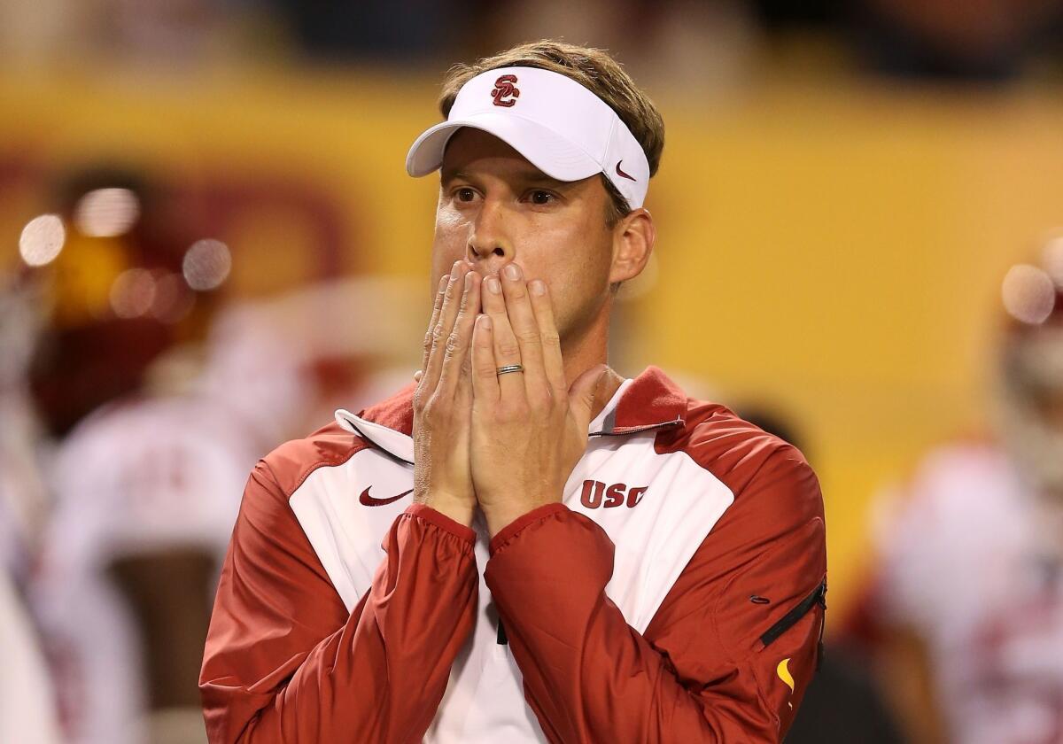 USC Coach Lane Kiffin reacts during the first half of the Trojans' game against Arizona State in Tempe, Ariz. on Saturday.