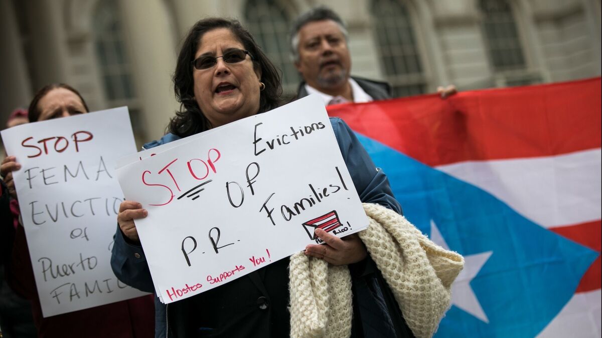 Activists rally April 19 at New York City Hall in support of Puerto Rican families displaced by Hurricane Maria.