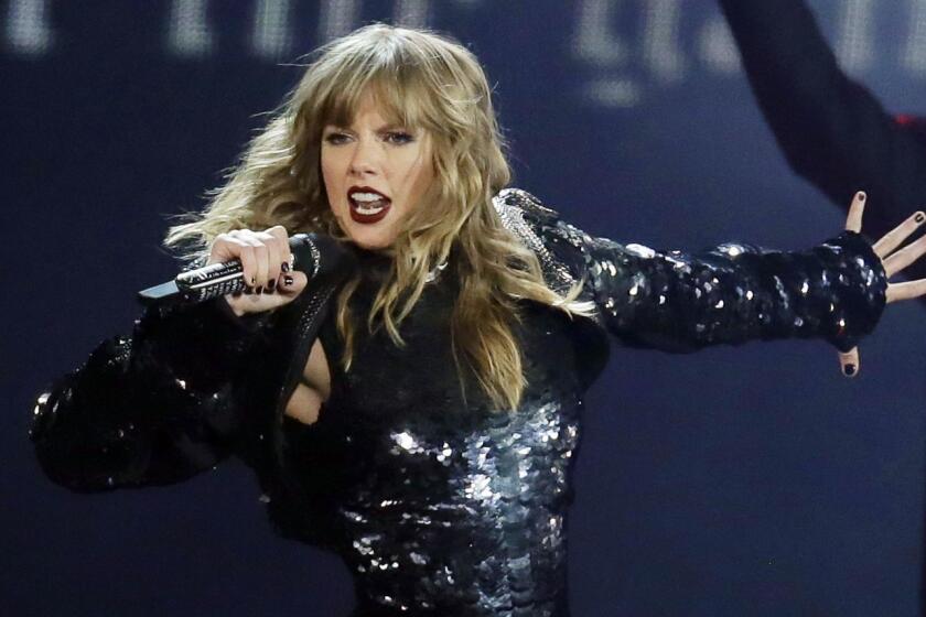 FILE - In this May 8, 2018, file photo, Taylor Swift performs during her "Reputation Stadium Tour" opener in Glendale, Ariz. Swift will open the 2018 American Music Awards. The singer made the announcement Tuesday, Oct. 2, on ABCs Good Morning America. (Photo by Rick Scuteri/Invision/AP, File)