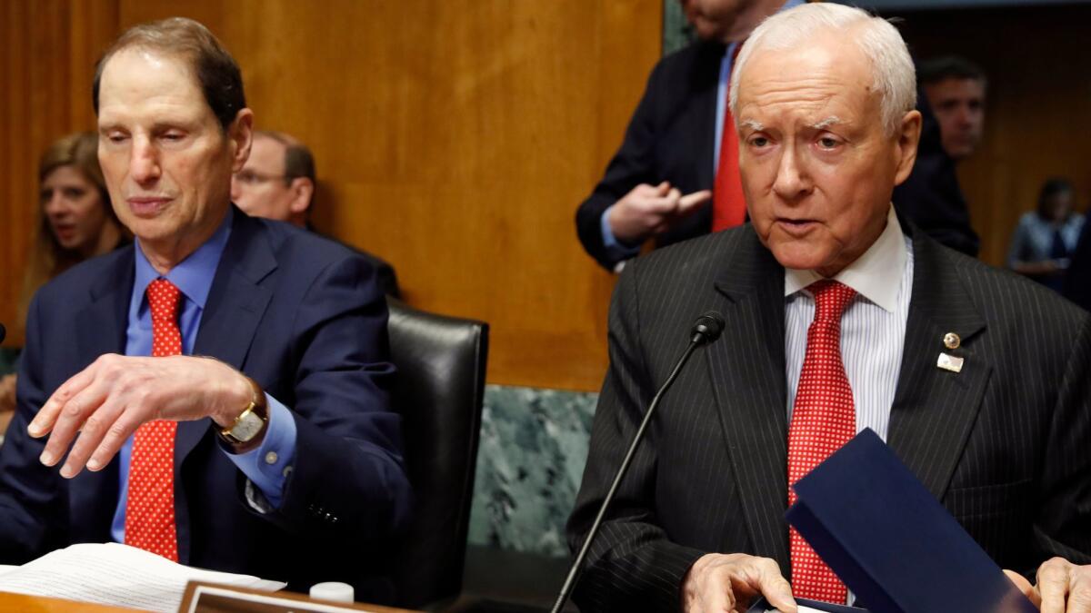 Sens. Ron Wyden (D-Ore.), left, and Orrin Hatch (R-Utah) reached an agreement last month to extend the Children's Health Insurance Program. Since then, there's been no legislative action and funding is running out in many states.