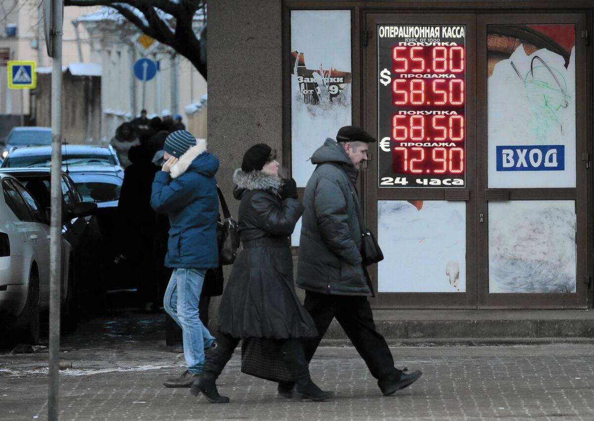 Russia has delved deeply into its hard-currency trove, using up $150 billion to put an end to its currency’s roller-coaster ride. Above, an exchange office in Moscow in December.