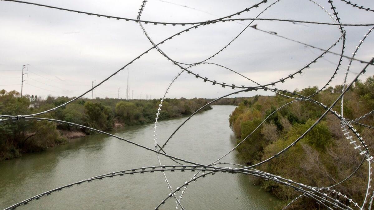 The Rio Bravo runs under the bridges connecting Hidalgo, Texas, just south of McAllen, with Reynoso, Mexico. President Trump will land in McAllen on Thursday for a border visit as part of his push to fund a wall.