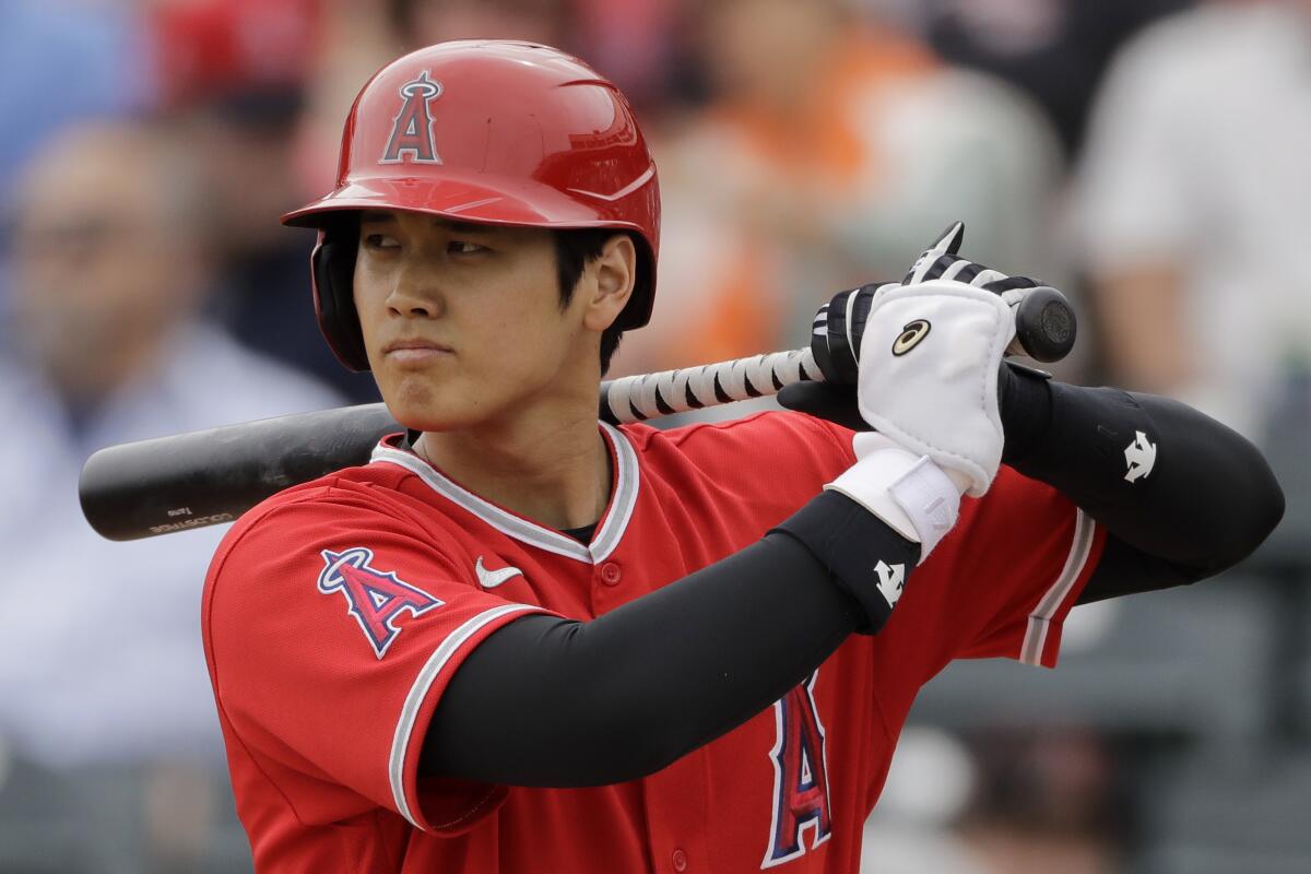 The Angels' Shohei Ohtani bats during spring training against the Rangers on Feb. 28, 2020, in Tempe, Ariz.