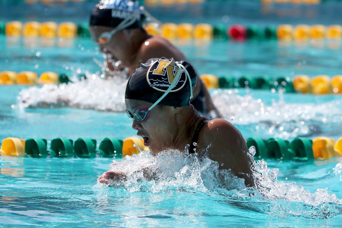 Fountain Valley's Kaitlyn Nguyen, bottom, competes against Los Alamitos' Iris Bayan in the girls' 200 individual medley.  