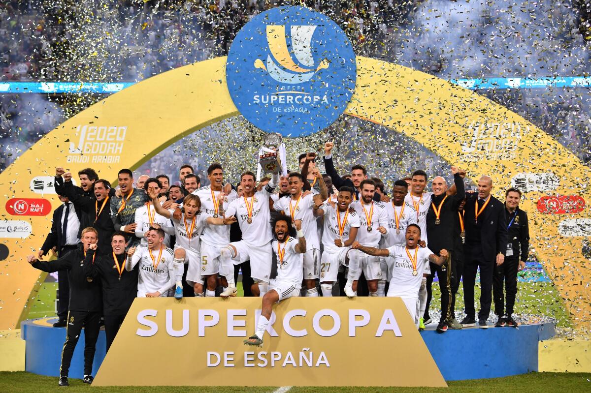 Real Madrid's players celebrate after winning the Spanish Super Cup final between Real Madrid and Atletico Madrid on January 12, 2020, at the King Abdullah Sports City in the Saudi Arabian port city of Jeddah. (Photo by Giuseppe CACACE / AFP) (Photo by GIUSEPPE CACACE/AFP via Getty Images)