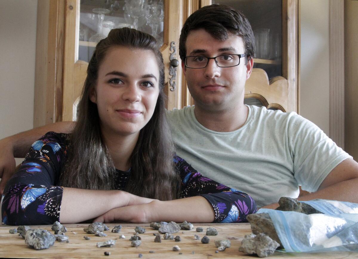 Henry Carradine and Karina Ille with the stones they collected.