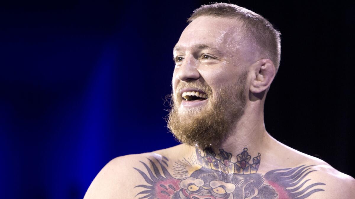 UFC featherweight champion Conor McGregor says a "publicized civil war" is behind him and he's "committed to the fight game."