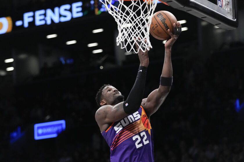 Phoenix Suns center Deandre Ayton goes to the basket during the second half of an NBA basketball game against the Brooklyn Nets, Tuesday, Feb. 7, 2023, in New York. The Suns won 116-112. (AP Photo/Mary Altaffer)