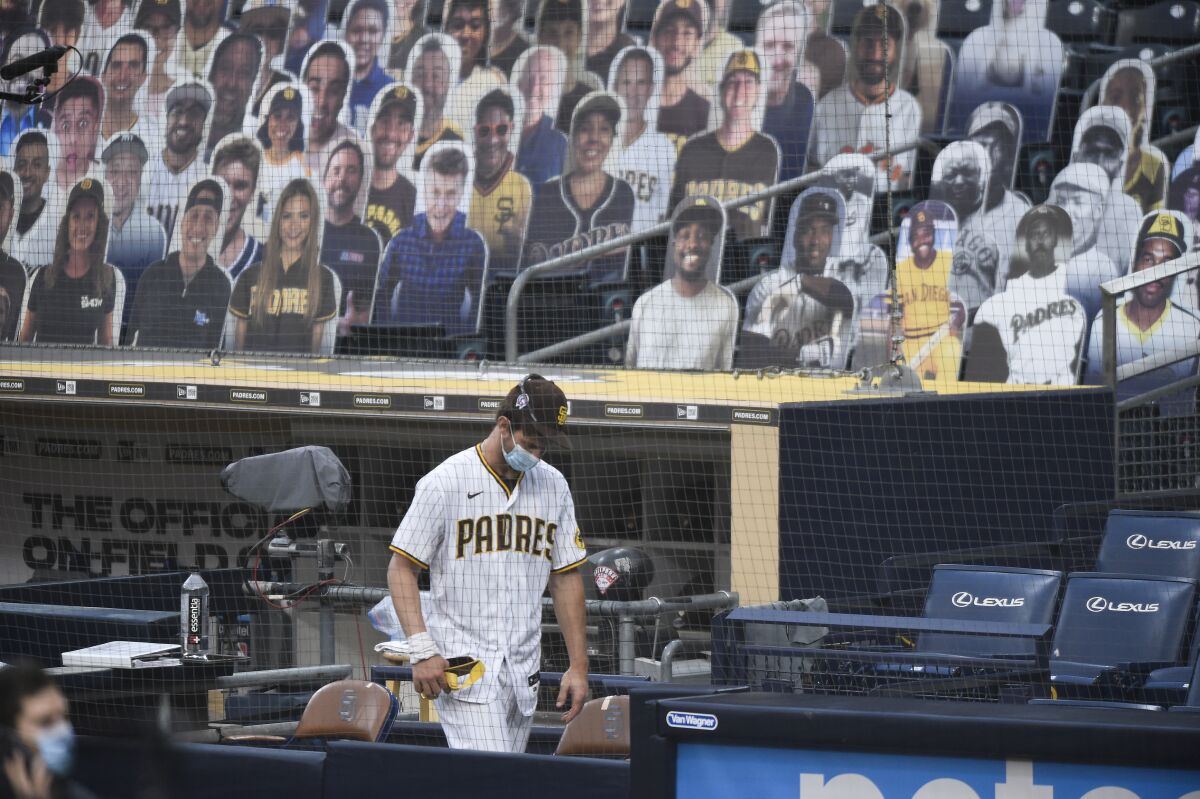 Wil Myers of the Padres walks in dugout before a scheduled game against the San Francisco Giants on Friday at Petco Park.