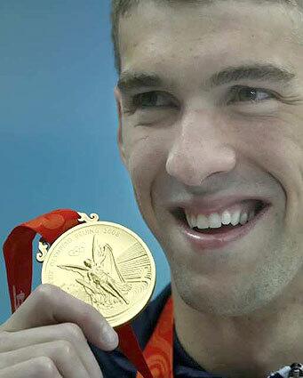 Michael Phelps with gold medal