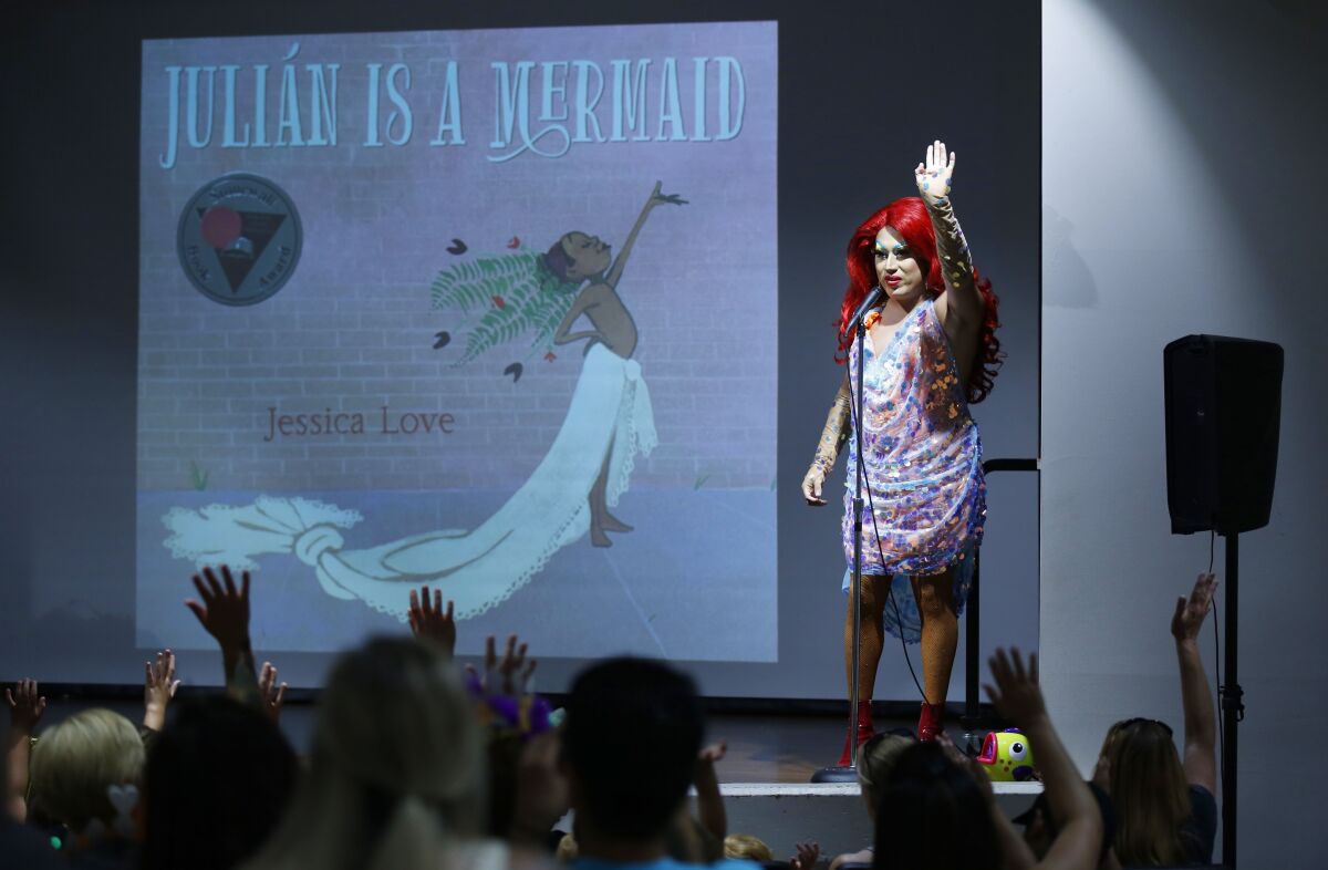 Raquel-Ita, a drag queen, gets ready to read the book "Julian Is A Mermaid" during Drag Queen Story Time at the Chula Vista Civic Center Library on Sept. 10, 2019.