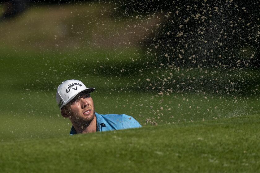PACIFIC PALISADES, CA - FEBRUARY 18, 2021: Leader Sam Burns watches his balls flight out of a green side bunker on the 12th hole during the first round of the Genesis Open at Riviera Country Club on February 18, 2021 in Pacific Palisades, California. He holds a two shot lead at 7 under par.(Gina Ferazzi / Los Angeles Times)