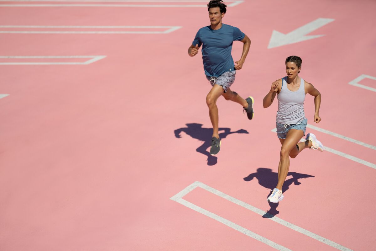 Two runners wearing Vuori apparel.