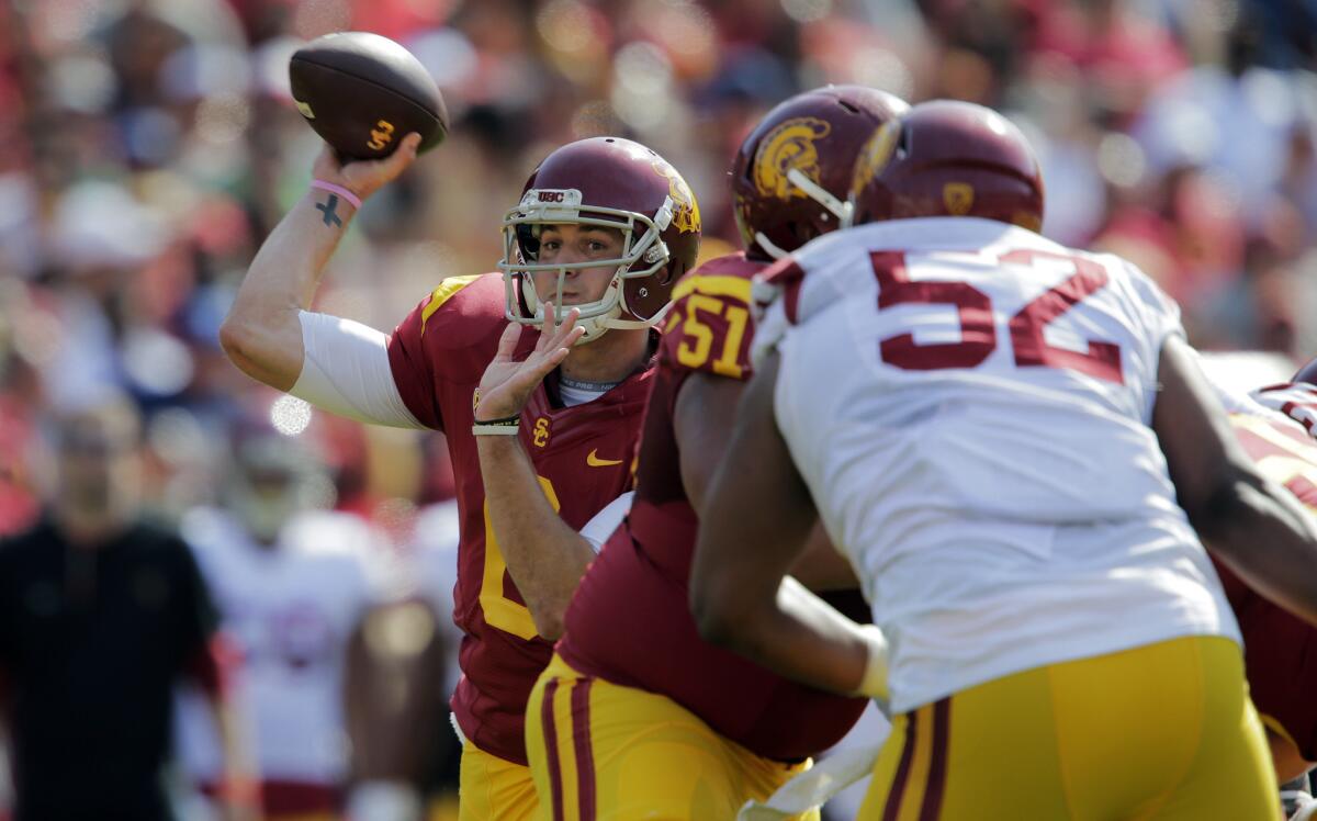 USC quarterback Cody Kessler looks for an open receiver during the Trojans' spring game at the Coliseum on April 11.