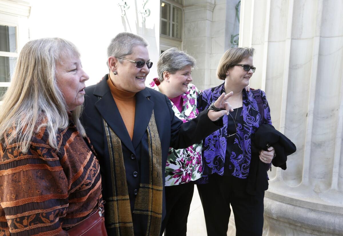 Plaintiffs challenging Oklahoma's same-sex marriage ban arrive at the courthouse in Denver. They are, left to right, Gay Phillips, partner Susan Barton, Sharon Baldwin and partner Mary Bishop.