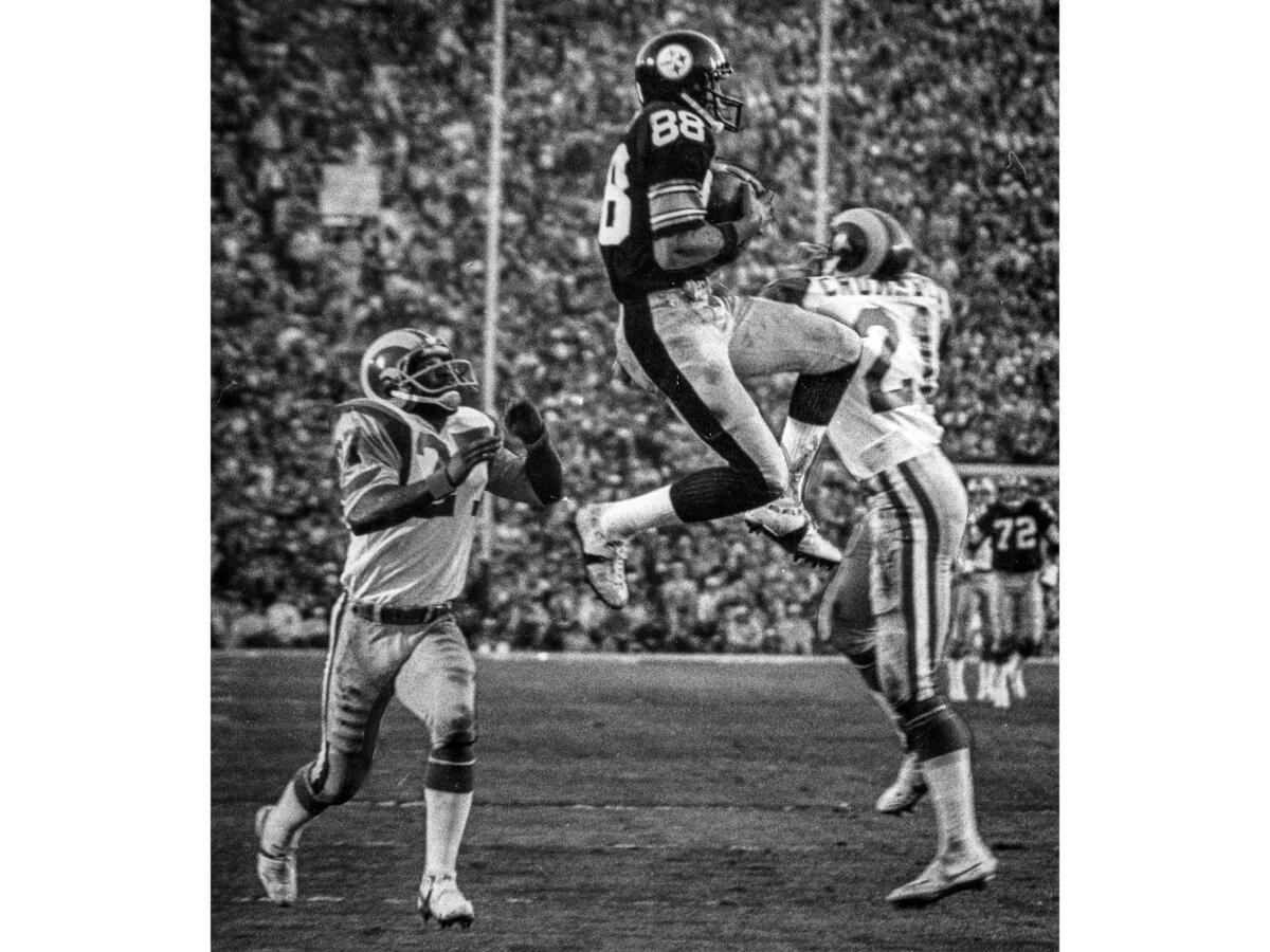 Jan. 20, 1980: Lynn Swan catches a 47-yard third quarter touchdown pass from Terry Bradshaw giving Pittsburgh a 17-13 lead. Rams defenders are Pat Thomas, left and Nolan Cromwell.