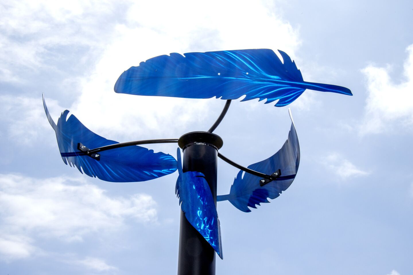 "Feathers in the Wind" by Alex G is on display at Newport Beach’s Civic Center Park on Saturday.
