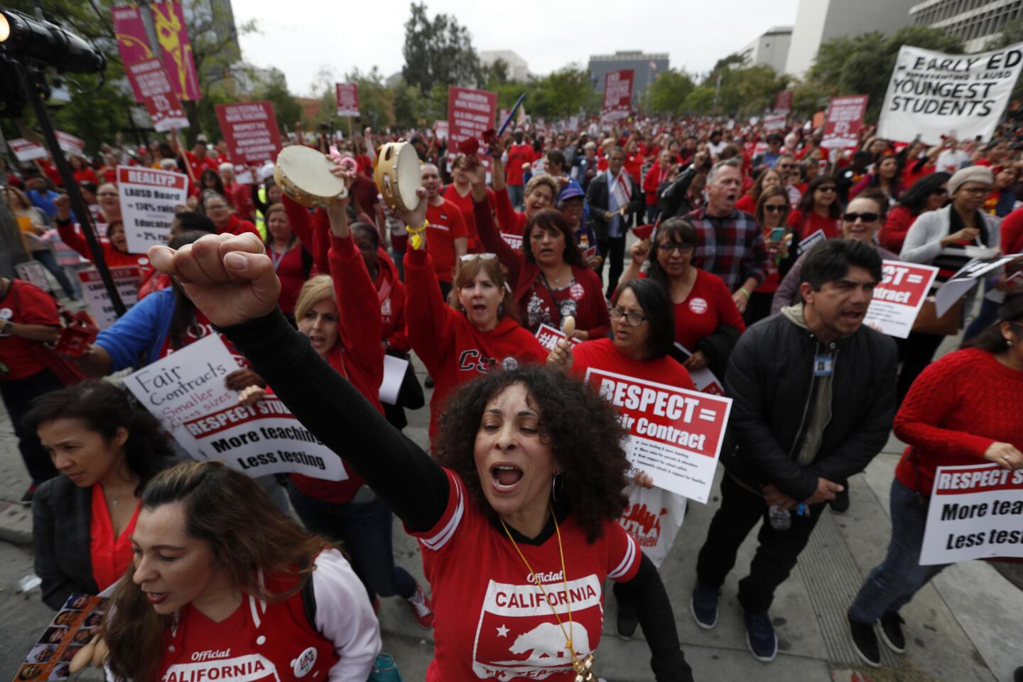 L.A Unified teachers shout during a union rally Thursday outside Los Angeles City Hall. Contract negotiations have been long stalled.